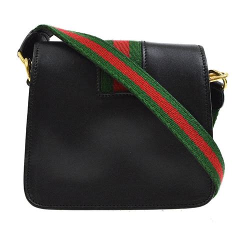 gucci sling black bag|Gucci crossbody with striped strap.